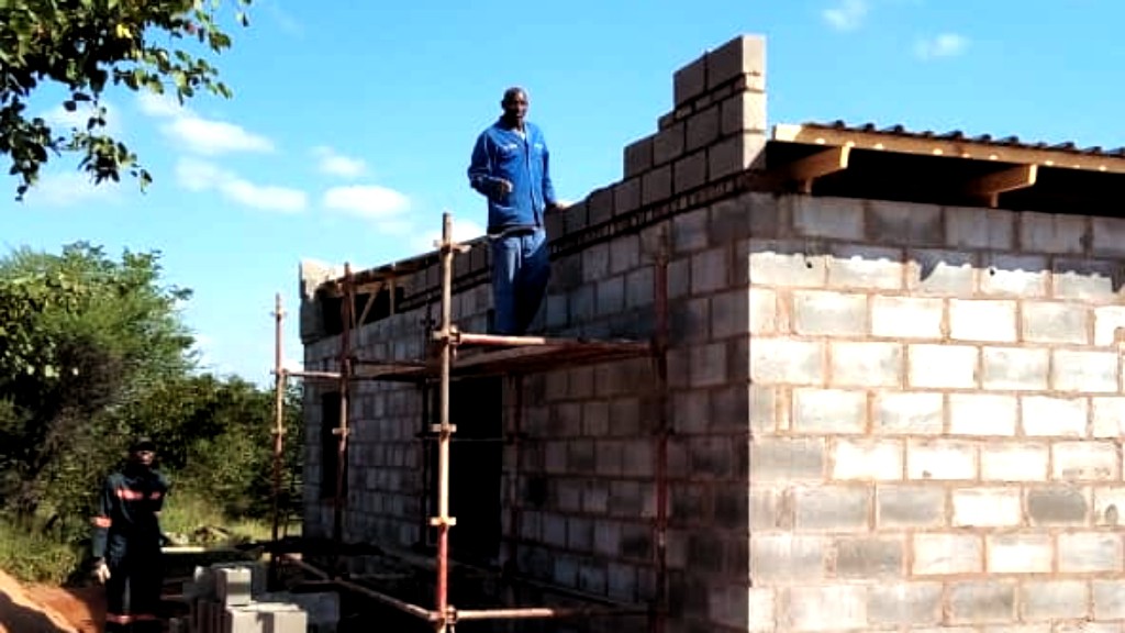 Roof being completed on the third orphan home